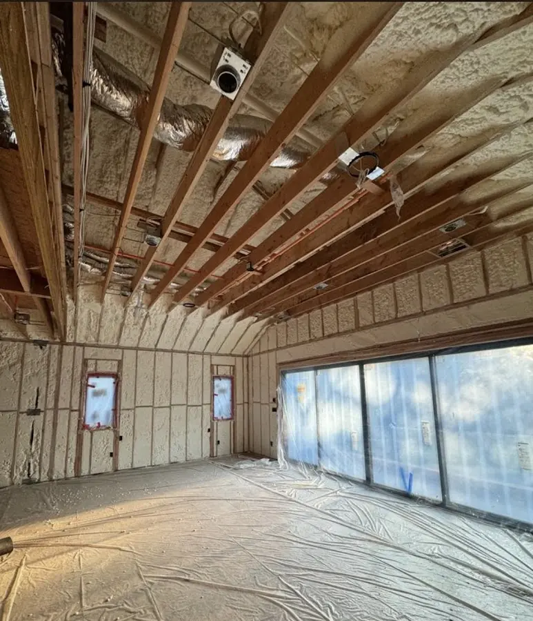 Interior walls and ceiling insulated with spray foam during new construction in Hopkins